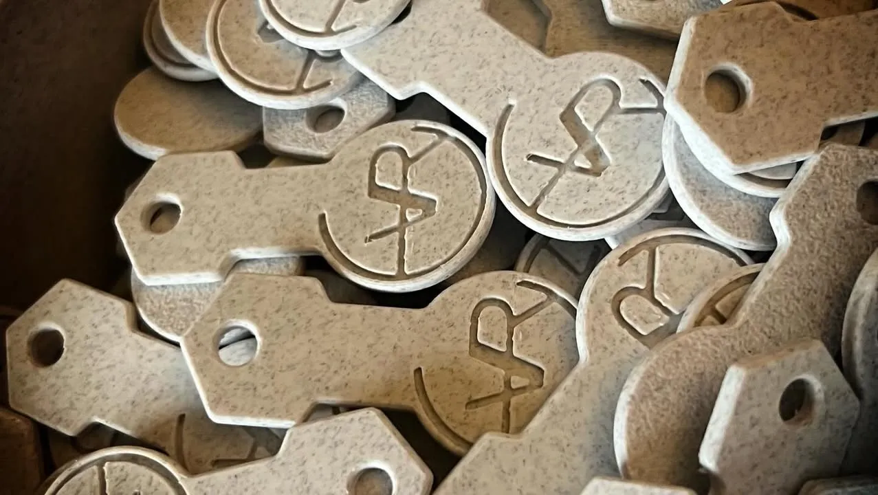 Winkelkar-munt in de vorm van sleutelhanger